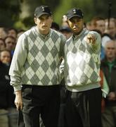 22 September 2006; Tiger Woods, Team USA 2006, consults with Jim Furyk on the 15th green during Friday morning's four-ball matches. 36th Ryder Cup Matches, K Club, Straffan, Co. Kildare, Ireland. Picture credit: Brendan Moran / SPORTSFILE