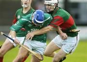 1 October 2006; Brian Carroll, Coolderry, in action against Michael Verney, Birr. Offaly Senior Hurling County Final 2006, Birr v Coolderry, St. Brendan's Park, Birr, Co. Offaly. Picture credit: Pat Murphy / SPORTSFILE