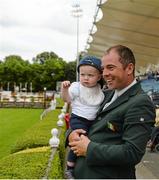 7 August 2014; Ireland's Cian O'Connor and his son Ben enjoy the Fáilte Ireland Dublin Horse Show before Cian competed in the Anglesea Stakes. Fáilte Ireland Dublin Horse Show 2014, RDS, Ballsbridge, Dublin. Picture credit: Piaras Ó Mídheach / SPORTSFILE