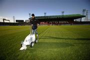 3 October 2006; Glentoran's Groundsman Samy Glover paints the lines on the pitch at the Oval for the CIS Insurance Cup Quarter-Final, Glentoran v Portadown, The Oval, Belfast. Picture credit: Russell Pritchard / SPORTSFILE