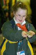 6 October 2006; Special Olympics Team Ireland athlete Holly Matthews, Gymnastics, shows off her 3 silver and 2 gold medals after Special Olympics Team Ireland, who competed with great success at the 2006 Special Olympics European Youth Games in Rome, Italy, arrived at Dublin Airport. Dublin Airport. Picture credit: Pat Murphy / SPORTSFILE