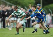 8 October 2006; James Regan, Loughrea, in action against Kevin Briscoe, Mullagh. Galway Senior Hurling Championship Semi-Final, Loughrea v Mullagh, Athenry, Galway. Picture credit: Ray Ryan / SPORTSFILE