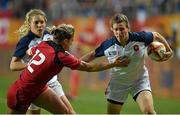 13 August 2014; Helene Ezanno, France, is tackled by Andrea Burk, Canada. 2014 Women's Rugby World Cup semi-final, France v Canada, Stade Jean Bouin, Paris, France. Picture credit: Brendan Moran / SPORTSFILE