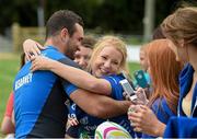 15 August 2014; Leinster's Dave Kearney receives a hug from Laura O'Donovan, from Gorey, Co. Wexford, after squad training at a Leinster Rugby Training Open Day held in Gorey RFC, Gorey, Co. Wexford. Picture credit: Matt Browne / SPORTSFILE