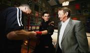 1 November 2006; Bernard Dunne getting tapped up by Harry Hawkins, Holy Trinity Boxing club, Belfast, and talking to Johnny Caldwell,right, former World Bantamweight champion in the 1960s from the Holy Trinity Boxing club,during open training to announce details of the upcoming European title fight against Esham Pickering. Holy Trinity Gym, Belfast, Co. Antrim. Picture credit: Oliver McVeigh / SPORTSFILE