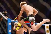 16 August 2014; Andy Young, right, in action against Paul Marin during their flyweight bout. Cage Warriors 70 Fight Night, The Helix, Dublin. Picture credit: Ramsey Cardy / SPORTSFILE