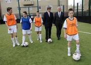 8 November 2006; The Minister for Arts, Sport and Tourism, Mr John O'Donoghue T.D., today announced an allocation of 3 million euro from the Irish Sports Council to the FAI for 2006. At the announcement are Mr John O'Donoghue T.D., and Chief Executive of the FAI John Delaney with 1st year students from CBS Westland Row, left to right, Sean Power, Glen Whelan, Jason Sheridan, and Dylan O'Toole. The FAI also announced the appointment of four Development. Recreational Area, Pearse Street, Dublin. Picture credit: Brian Lawless / SPORTSFILE