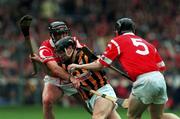 12 September 1999; P.J Delaney, Kilkenny in action against Brian Corcoran and Wayne Sherlock (5) Cork. Cork v Kilkenny, All-Ireland Hurling Final, Croke Park, Dublin. Picture credit; Brendan Moran/SPORTSFILE