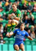 23 August 2014; George North, Northampton Saints, secures possession ahead of Adam Byrne, Leinster. Pre-Season Friendly, Northampton Saints v Leinster, Franklins Gardens, Northampton, England. Picture credit: Ramsey Cardy / SPORTSFILE