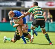 23 August 2014; Darragh Fanning, Leinster, is tackled by Calum Clark, left, and Tom Stephenson, Northampton Saints. Pre-Season Friendly, Northampton Saints v Leinster, Franklins Gardens, Northampton, England. Picture credit: Ramsey Cardy / SPORTSFILE