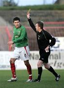 25 November 2006; Willo McDonagh, Glentoran, gets shown the yellow card by Referee Stephen Moore. Carnegie Premier League, Glentoran v Glenavon, The Oval, Belfast. Picture credit:  Russell Pritchard / SPORTSFILE