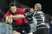 25 November 2006;   Trevor Halstead, Munster, is tackled by Steve Tandy, Neath Swansea Ospreys. Magners League, Munster v Neath Swansea Ospreys, Thomond Park, Limerick. Picture credit: Kieran Clancy / SPORTSFILE