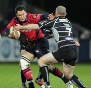 25 November 2006; Trevor Halstead, Munster, is tackled by Steve Tandy, Neath Swansea Ospreys. Magners League, Munster v Neath Swansea Ospreys, Thomond Park, Limerick. Picture credit: Kieran Clancy / SPORTSFILE