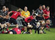 25 November 2006; Stefan Terblanche, Neath Swansea Ospreys, is tackled by James Couglan, Alan Quinlan and Andy Kyriacout, 2, Munster. Magners League, Munster v Neath Swansea Ospreys, Thomond Park, Limerick. Picture credit: Kieran Clancy / SPORTSFILE
