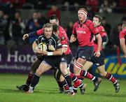 25 November 2006; Justin Marshall, Neath Swansea Ospreys, is tackled by Tim McGann, Munster. Magners League, Munster v Neath Swansea Ospreys, Thomond Park, Limerick. Picture credit: Kieran Clancy / SPORTSFILE