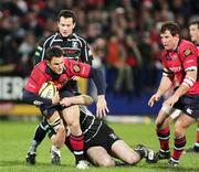 25 November 2006; Trevor Halstead, Munster, is tackled by Steve Tandy, Neath Swansea Ospreys. Magners League, Munster v Neath Swansea Ospreys, Thomond Park, Limerick. Picture credit: Kieran Clancy / SPORTSFILE