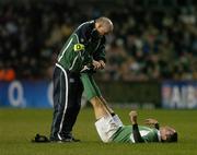 26 November 2006; Paddy Wallace, Ireland, is treated for cramp by team doctor Dr. Jim McShane. Autumn Internationals, Ireland v The Pacific Islands, Lansdowne Road, Dublin. Picture credit: Brendan Moran / SPORTSFILE