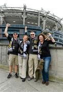 30 August 2014; UCF faithful, from left, Ryan and Sandra Beauchamp join friends Richard and Bianca Lawrence in a cheer. Croke Park Classic 2014, Penn State v University of Central Florida. Croke Park, Dublin. Picture credit: Cody Glenn / SPORTSFILE