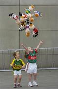 4 December 2006; Aidan Hegarty, age 3, and his sister Cara, aged 5, from Armagh, at the launch of 'RUA', the new children's GAA mascot created by Sports Merchandising Ireland Ltd. RUA is a soft toy which comes decked out in your favourite county colours and is available now. Croke Park, Dublin. Picture credit: Pat Murphy / SPORTSFILE