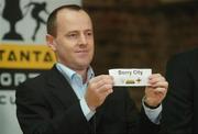 7 December 2006; Niall Cogley, Setanta Sports, pulls the name of Derry City at the draw for the 2007 Setanta Sports Cup. Coach House, Dublin Castle, Dublin. Picture credit: Pat Murphy / SPORTSFILE