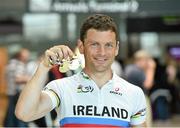 3 September 2014; The Irish Paracycling Team returned from the 2014 UCI Paracycling Road World Championships in Greenville, USA. The Irish team of five bikes won a total of four medals; Eoghan Clifford won double gold in the time trial and road race C3 class, Katie George Dunlevy and Eve McCrystal won silver in the visually impaired tandem road race and handcyclist Mark Rohan won bronze in the H2 time trial. Pictured on his arrival is Eoghan Clifford, from Galway Bay CC, Co. Galway, who won double gold in the time trial and road race C3 class. Dublin Airport, Dublin. Picture credit: Stephen McCarthy / SPORTSFILE