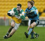 7 January 2007; Nigel Grennan, Offaly, in action against Paul Kelly, UCD. O'Byrne Cup, First Round, Offaly v UCD, O'Connor Park, Tullamore, Co. Offaly. Picture credit: David Maher / SPORTSFILE