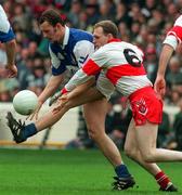 6 April 1997; Hugh Emerson of Laois in action against Henry Downey of Derry during National Football League Division 4 Quarter-Final between Laois and Derry at Croke Park in Dublin. Photo by Brendan Moran/Sportsfile