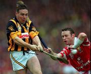 12 September 1999; Charlie Carter of Kilkenny in action against Fergal Ryan of Cork during the Guinness All-Ireland Senior Hurling Championship Final between Cork and Kilkenny at Croke Park in Dublin. Photo by Ray McManus/Sportsfile