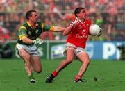 26 September 1999; Don Davis of Cork in action against Evan Kelly of Meath during the Bank of Ireland All-Ireland Senior Football Championship Final match between Meath and Cork at Croke Park in Dublin. Photo by Brendan Moran/Sportsfile