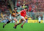 12 September 1999; Fergal McCormack of Cork in action against Peter Barry of Kilkenny during the Guinness All-Ireland Senior Hurling Championship Final between Cork and Kilkenny at Croke Park in Dublin. Photo by Damien Eagers/Sportsfile
