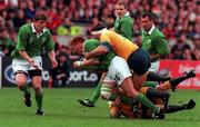 10 October 1999; Jonathan Bell of Ireland is tackled by Tim Horan, grounded, and Tiann Strauss of Australia during the Rugby World Cup Pool E match between Ireland and Australia at Lansdowne Road in Dublin. Photo by Brendan Moran/Sportsfile