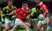26 September 1999; Hank Traynor of Meath in action against Micheal Cronin of Cork during the Bank of Ireland All-Ireland Senior Football Championship Final match between Meath and Cork at Croke Park in Dublin. Photo by Brendan Moran/Sportsfile