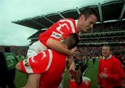 12 September 1999; Sean McGrath of Cork is lifted by team-mate Diarmuid O'Sullivan in celebration following the Guinness All-Ireland Senior Hurling Championship Final between Cork and Kilkenny at Croke Park in Dublin. Photo by Damien Eagers/Sportsfile