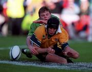 10 October 1999; Brian O'Driscoll of Ireland in action against Stephen Larkham of Australia during the Rugby World Cup Pool E match between Ireland and Australia at Lansdowne Road in Dublin. Photo by Brendan Moran/Sportsfile