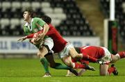 2 February 2007; Ian Keatley, Ireland, is tackled by Robert Lewis, Wales. U20 Six Nations Rugby Championship, Wales v Ireland, Liberty Stadium, Swansea, Wales. Picture credit: Brendan Moran / SPORTSFILE