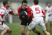 4 February 2007; Dan Gordon, Down, in action against Colin Goss and John O'Brien, Louth. Allianz NFL, Division 1B, Louth v Down, Gaelic Grounds, Drogheda, Co. Louth. Picture credit: Oliver McVeigh / SPORTSFILE