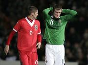 6 February 2007; Chris Brunt, Northern Ireland, holds his head in his hands after missing a chance, as Carl Robinson, Wales, looks on. International friendly, Northern Ireland v Wales, Windsor Park, Belfast, Co. Antrim. Picture Credit: Russell Pritchard / SPORTSFILE
