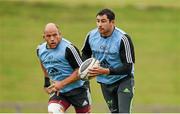 15 September 2014; Munster's Felix Jones, right, supported by team-mate BJ Botha, during squad training ahead of their side's Guinness PRO12, Round 3, match against Zebre on Friday. Munster Rugby Squad Training, University of Limerick, Limerick. Picture credit: Diarmuid Greene / SPORTSFILE