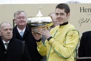 10 February 2007; Andrew McNamara with his trophy after his victory aboard Beef Or Salmon in The Hennessy Cognac Gold Cup. Pictured with owner Joe Craig, left, and Minister for Sport, Tourism and Arts, John O'Donoghue. Leopardstown Racecourse, Leopardstown, Dublin. Picture credit: SPORTSFILE