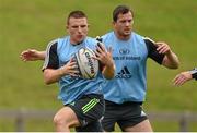 15 September 2014; Munster's Andrew Conway, supported by team-mate Denis Hurley, in action during squad training ahead of their side's Guinness PRO12, Round 3, match against Zebre on Friday. Munster Rugby Squad Training, University of Limerick, Limerick. Picture credit: Diarmuid Greene / SPORTSFILE