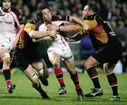 16 February 2007; Isaac Boss, Ulster, is tackled by Adam Black and Peter Sidoli, Dragons. Magners League, Ulster v Dragons, Ravenhill Park, Belfast Co. Antrim. Picture credit: Oliver McVeigh / SPORTSFILE