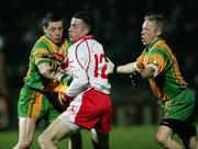 17 February 2007; Christopher Colhoun, Tyrone, is tackled by Donegal players Paddy McConigley and Brian Roper. McKenna Cup Final, Donegal v Tyrone, Healy Park, Omagh, Co. Tyrone. Picture credit: Oliver McVeigh / SPORTSFILE