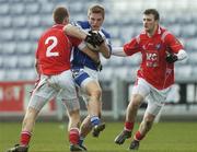 25 February 2007; Ross Munnelly, Laois, in action against David Brennan, left, and Mark Brennan, Louth. Allianz National Football League, Division 1B, Round 3, Laois v Louth, O'Moore Park, Portlaoise, Co. Laois. Photo by Sportsfile