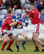 25 February 2007; Paul Lawlor, Laois, in action against Paddy Keenan, left, and Dessie Finnegan, Louth. Allianz National Football League, Division 1B, Round 3, Laois v Louth, O'Moore Park, Portlaoise, Co. Laois. Photo by Sportsfile