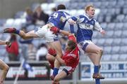 25 February 2007; Brendan Quigley, left, and Pauric Clancy, Laois, in action against Paddy Keenan, Louth. Allianz National Football League, Division 1B, Round 3, Laois v Louth, O'Moore Park, Portlaoise, Co. Laois. Photo by Sportsfile *** Local Caption ***