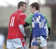 25 February 2007; Mark Brennan, Louth, and Pauric McMahon, Laois, exchange words behind referee Syl Doyle's back. Allianz National Football League, Division 1B, Round 3, Laois v Louth, O'Moore Park, Portlaoise, Co. Laois. Photo by Sportsfile *** Local Caption ***