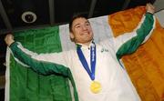 5 March 2007; Ireland's European 400m Indoor Champion David Gillick with his gold winner's medal, returns from the European Indoor Athletics Championships. Dublin Airport, Dublin. Picture credit: David Maher / SPORTSFILE