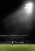 5 March 2007; Alan McDonald,Glentoran coach, puts out the training cones under the rain, after the pitch was passed for the match to proceed. Setanta Cup Group 1, Linfield v Glentoran, Windsor Park, Belfast. Picture credit: Russell Pritchard  / SPORTSFILE