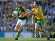 21 September 2014; David Moran, Kerry, in action against Leo McLoone, Donegal. GAA Football All Ireland Senior Championship Final, Kerry v Donegal. Croke Park, Dublin. Picture credit: Brendan Moran / SPORTSFILE