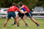 27 September 2014; Aiden McDonald, Leinster, is tackled by David Gleeson, left, and Jack Quilter, Munster. Under 18 Club Interprovincial, Munster v Leinster. Waterpark RFC, Waterford. Picture credit: Ramsey Cardy / SPORTSFILE